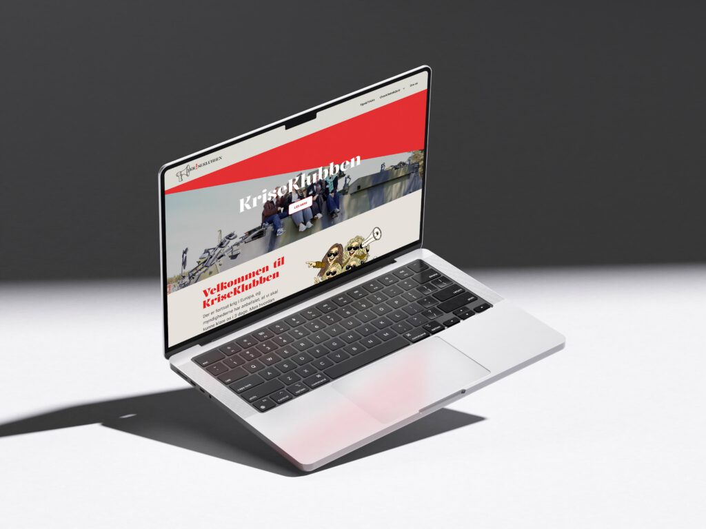Hjemmeside for kriseklubben vist på macbook
